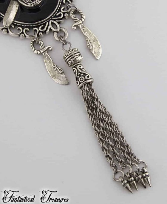 Close up of tassel on pirate skull necklace
