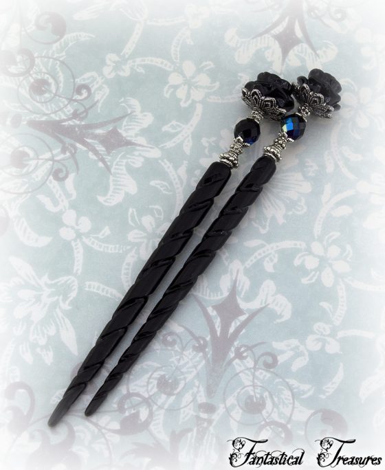 black rose hair sticks with jet ab bead taken on fancy back drop